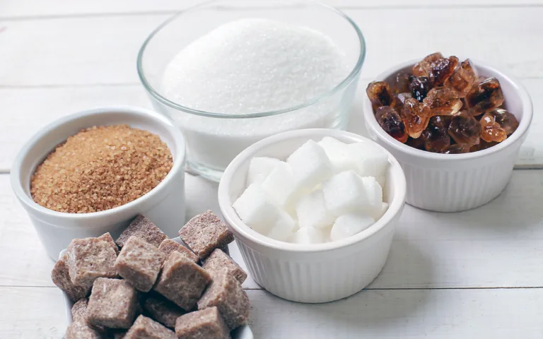 A collection of sugar cubes, illustrating the various types of sugar and their effects on health and wellness.