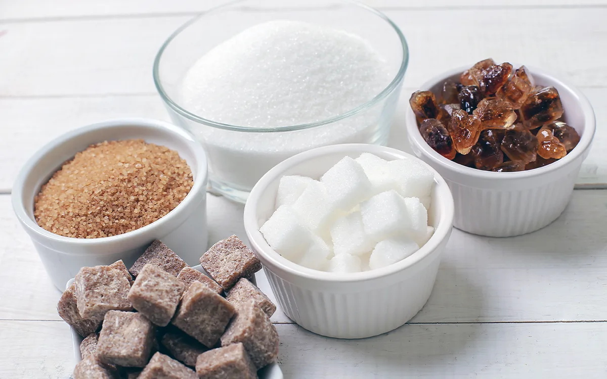 A collection of sugar cubes, illustrating the various types of sugar and their effects on health and wellness.