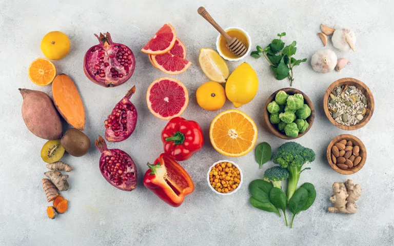 A colorful assortment of fruits and vegetables displayed in bowls, highlighting the diversity of plant-based nutrients.