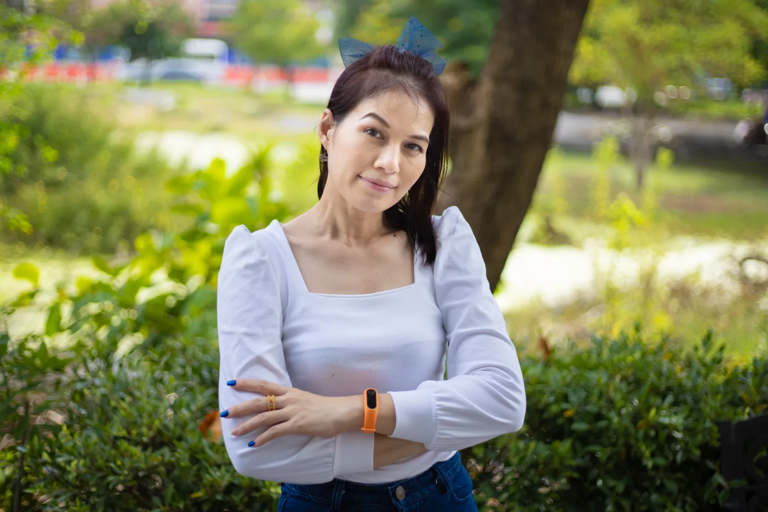 Confident middle-aged woman standing outdoors, symbolizing improved energy, mood balance, and overall wellness during menopause through healthy nutrition.