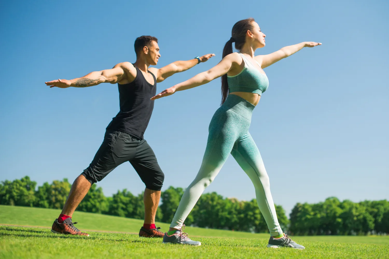 Man and woman exercising outdoors, symbolizing active lifestyle habits combined with natural foods like bitter melon for better blood sugar control.