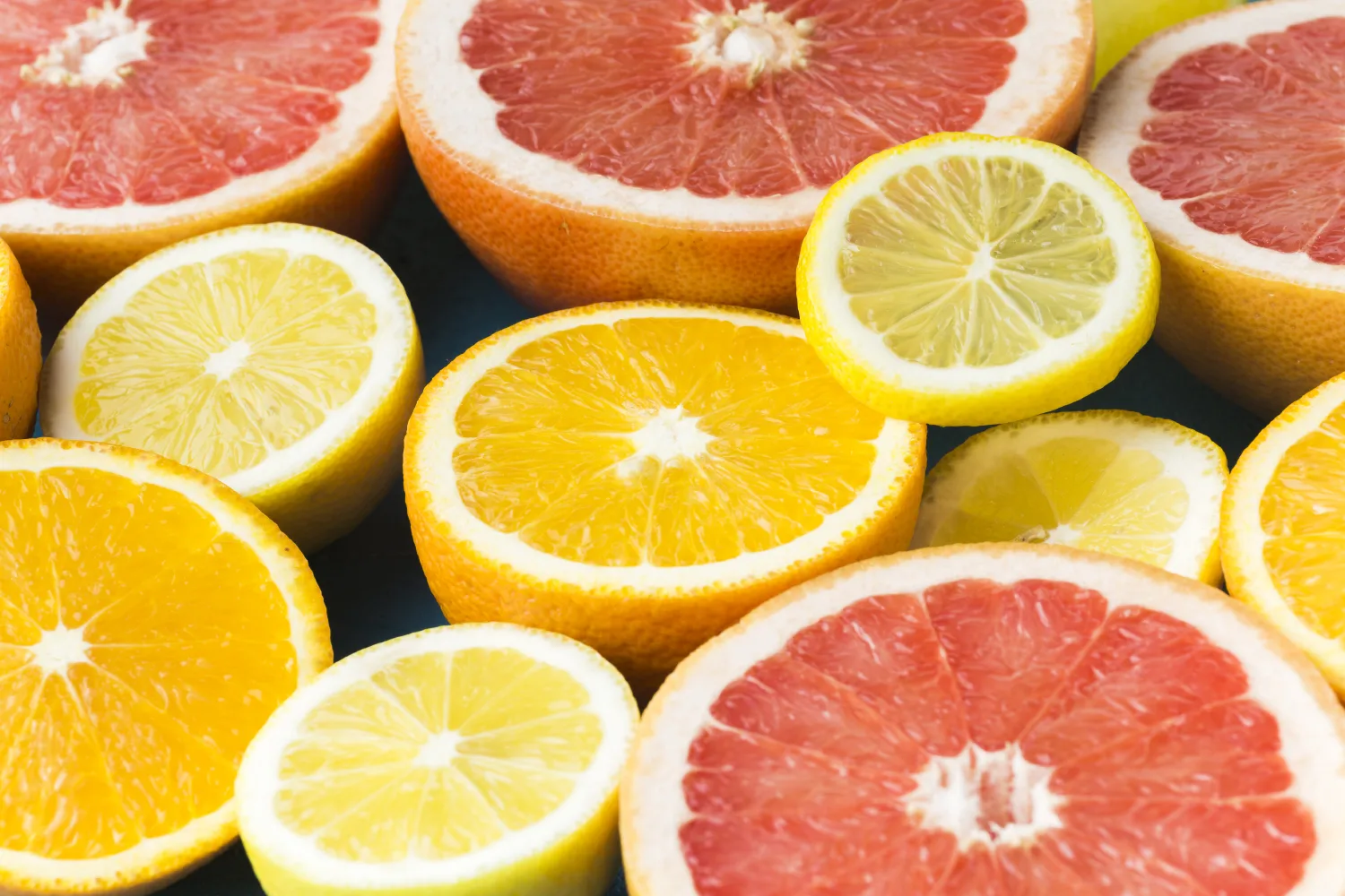 Fresh sliced citrus fruits including oranges, lemons and grapefruit packed with vitamin C to boost energy during March season