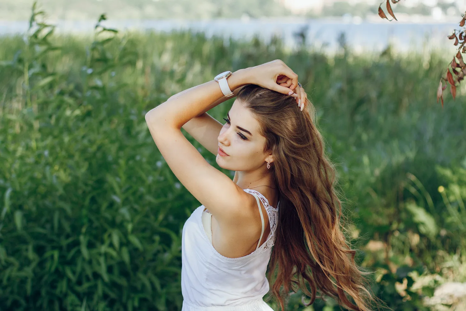 Young woman outdoors with long healthy hair representing strong hair growth supported by proper nutrition, vitamins and mineral intake