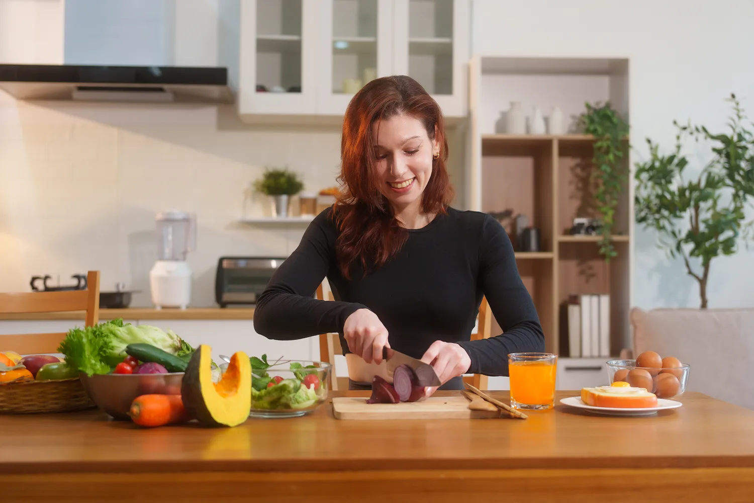 Woman preparing healthy vegetables and balanced meals to support daily liver wellness and healthy lifestyle habits naturally