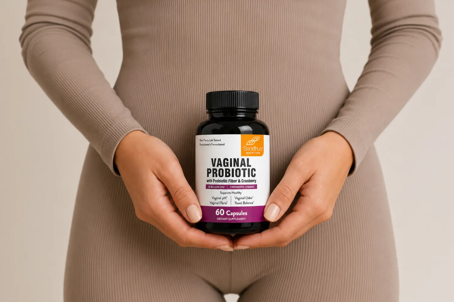 Woman holding a vaginal probiotic supplement, highlighting support for vaginal microbiome balance, feminine wellness, and healthy vaginal flora.